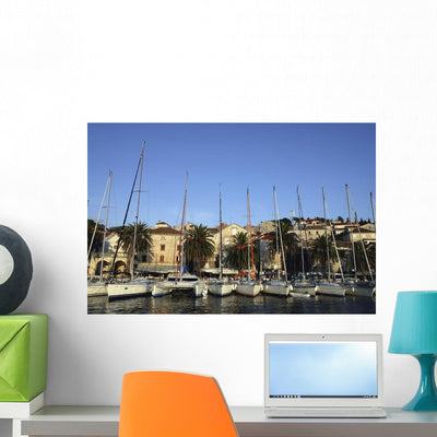 Sailboats Lined up Hvar Wall Mural shown on a wall