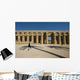 Man Walking Past Shadow Of Date Palm In Forecourt Wall Mural