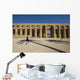 Man Walking Past Shadow Of Date Palm In Forecourt Wall Mural