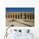 Man Walking Past Shadow Of Date Palm In Forecourt Wall Mural