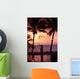 Native In A Grass Skirt Holding A Flaming Torch By Coast At Sunset Wall Mural
