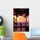 Native In A Grass Skirt Holding A Flaming Torch By Coast At Sunset Wall Mural