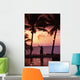 Native In A Grass Skirt Holding A Flaming Torch By Coast At Sunset Wall Mural