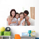 Happy family eating pizza Wall Mural