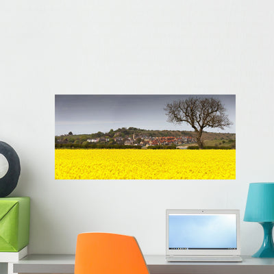 Field Yellow Flowers beside Wall Mural shown on a wall