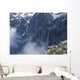 Walker Looking Over Waterfall At Cirque De Gavarnie Wall Mural