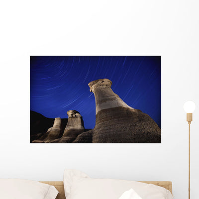 Hoodoos and Star Trails Wall Mural shown on a wall