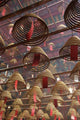 Smoking Incense Spirals At The Man Mo Temple In Hong Kong, Close Up Wall Mural
