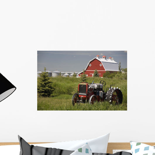 Old Red Tractor In A Field With A Red Barn In The Background Wall Mural