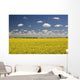 Flowering Canola Field With Clouds Overhead Wall Mural