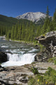 Waterfalls With Rock Ledge And Mountain In The Background Wall Mural