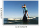 A Woman Paddling While Standing On A Surf Board Off Dos Mares Beach Wall Mural