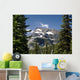 Mountain Peak Framed Between Trees Under A Blue Sky Wall Mural