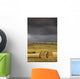 Hay Bales In A Field Under A Dark Cloudy Sky Wall Mural
