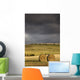 Hay Bales In A Field Under A Dark Cloudy Sky Wall Mural