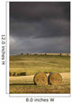 Hay Bales In A Field Under A Dark Cloudy Sky Wall Mural