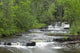 Cascading Falls Along A Creek Wall Mural