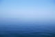 Calm Blue Water Disappearing Into Horizon Wall Mural