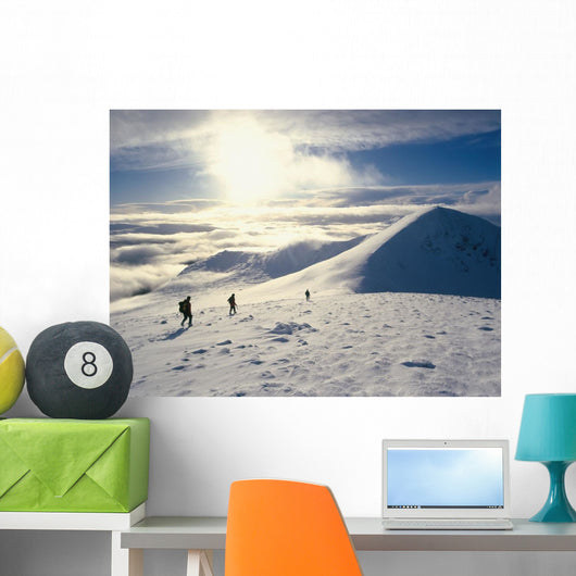 Hikers On A Mountaintop In The Snow Wall Mural