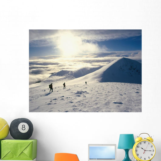 Hikers On A Mountaintop In The Snow Wall Mural