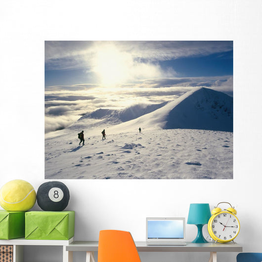 Hikers On A Mountaintop In The Snow Wall Mural