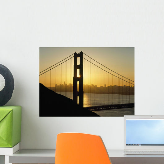 Yellow Sunrise Behind The Golden Gate Bridge With Skyline Behind Wall Mural