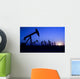 Silhouette of oil pump jacks with sunset Wall Mural