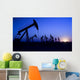 Silhouette of oil pump jacks with sunset Wall Mural