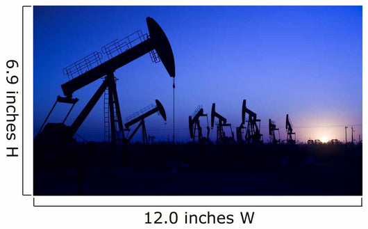 Silhouette of oil pump jacks with sunset Wall Mural