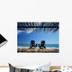 Two Chairs On Deck By Ocean Shaded By Grass Roof Wall Mural