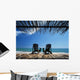 Two Chairs On Deck By Ocean Shaded By Grass Roof Wall Mural
