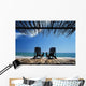 Two Chairs On Deck By Ocean Shaded By Grass Roof Wall Mural