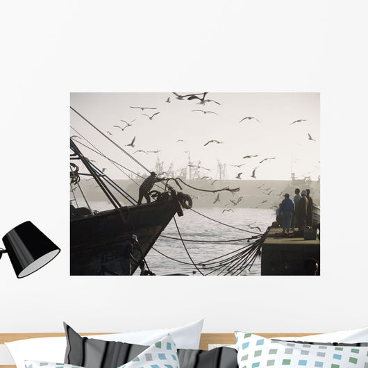 Man Throwing Rope To People On Dockside Of Harbor At Dusk Wall Mural