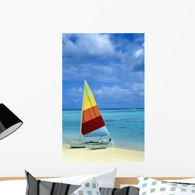 Catamaran Tropical Beach Wall Mural shown on a wall