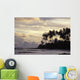 Silhouetted Palm Trees Over Beach At Sunset Wall Mural