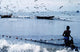 Fisherman Collecting Nets On Beach Wall Mural