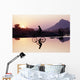 Bicyclist Crossing Shallow River At Sunset With Women Wall Mural