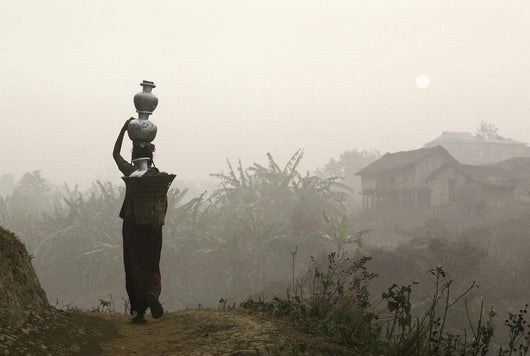 Bru Tribeswoman Carrying Water Pots On Her Head At Sunrise Wall Mural