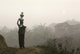 Bru Tribeswoman Carrying Water Pots On Her Head At Sunrise Wall Mural