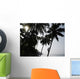 Silhouetted Man Climbing A Palm Tree To Pick Coconuts Wall Mural