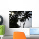 Silhouetted Man Climbing A Palm Tree To Pick Coconuts Wall Mural