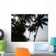 Silhouetted Man Climbing A Palm Tree To Pick Coconuts Wall Mural