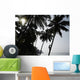 Silhouetted Man Climbing A Palm Tree To Pick Coconuts Wall Mural