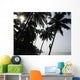 Silhouetted Man Climbing A Palm Tree To Pick Coconuts Wall Mural