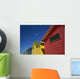 Seagull Flying Over Colorful Beach Huts Wall Mural
