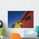 Seagull Flying Over Colorful Beach Huts Wall Mural