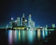 Business District Skyline At Night, With Reflections In Water Wall Mural