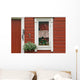 Red Wooden House With Plants In And By Window, Close Up Wall Mural