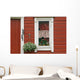Red Wooden House With Plants In And By Window, Close Up Wall Mural