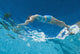 Underwater View Of Woman Diving Into Pool Wall Mural
